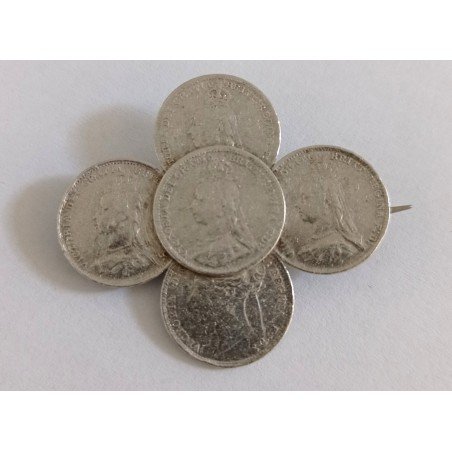Silver brooch with Victorian threepence coins
