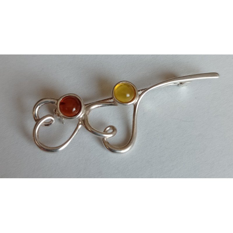 Silver brooch with amber