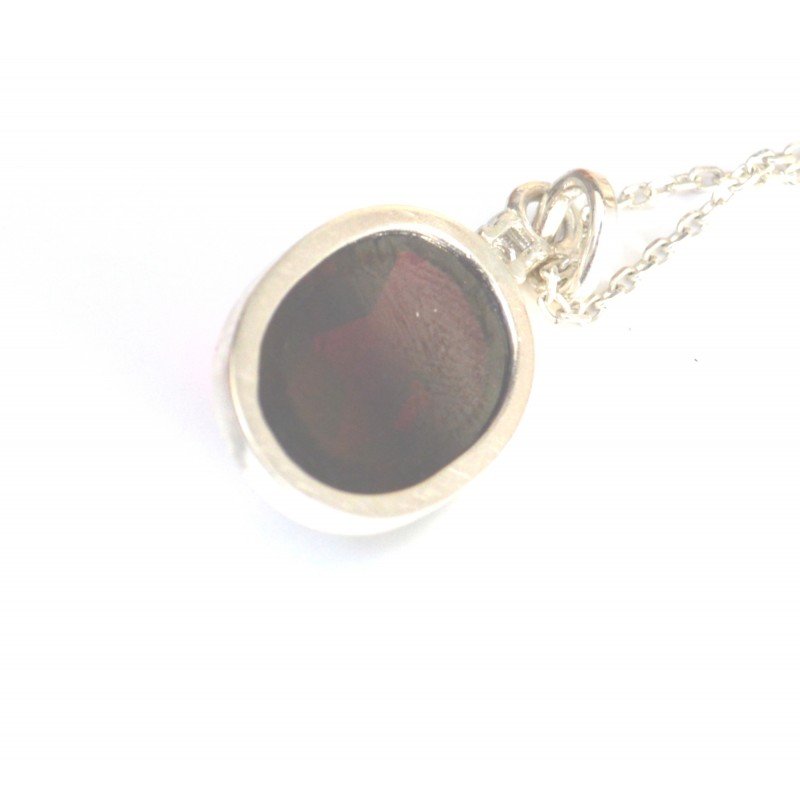 Garnet and diamond pendant in silver mount