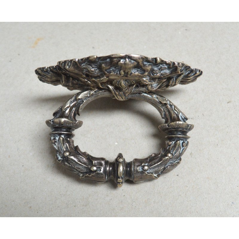 White metal handle decorated with lion heads,...
