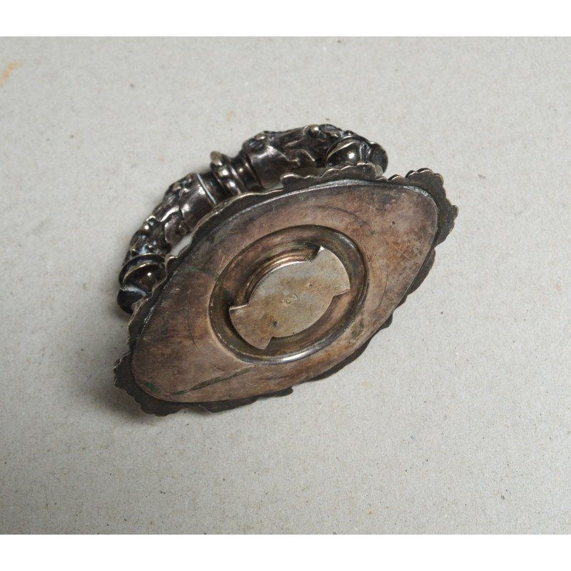 White metal handle decorated with lion heads,...